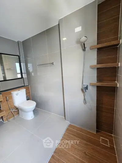 Modern bathroom with sleek tiles and open shower design