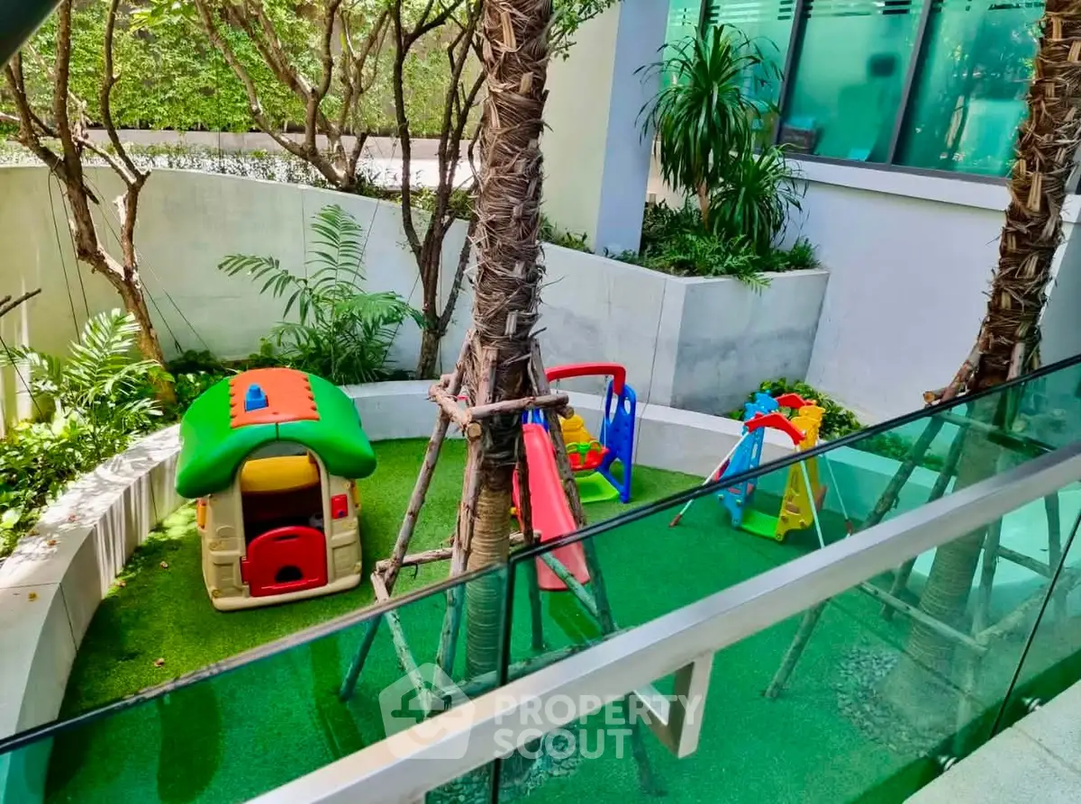 Charming outdoor play area with swings and playhouse in lush garden setting.
