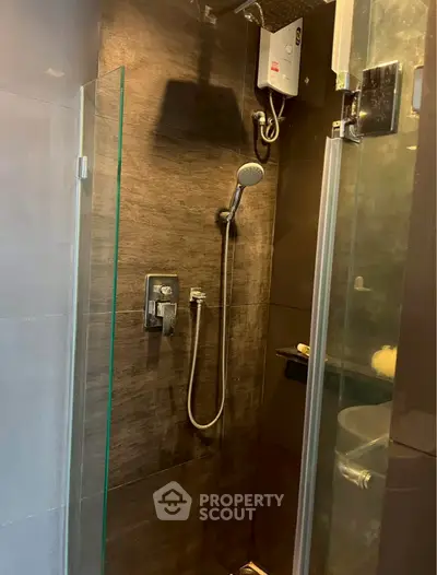 Modern bathroom shower with sleek glass door and contemporary fixtures