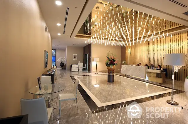 Luxurious hotel lobby with elegant lighting and marble flooring