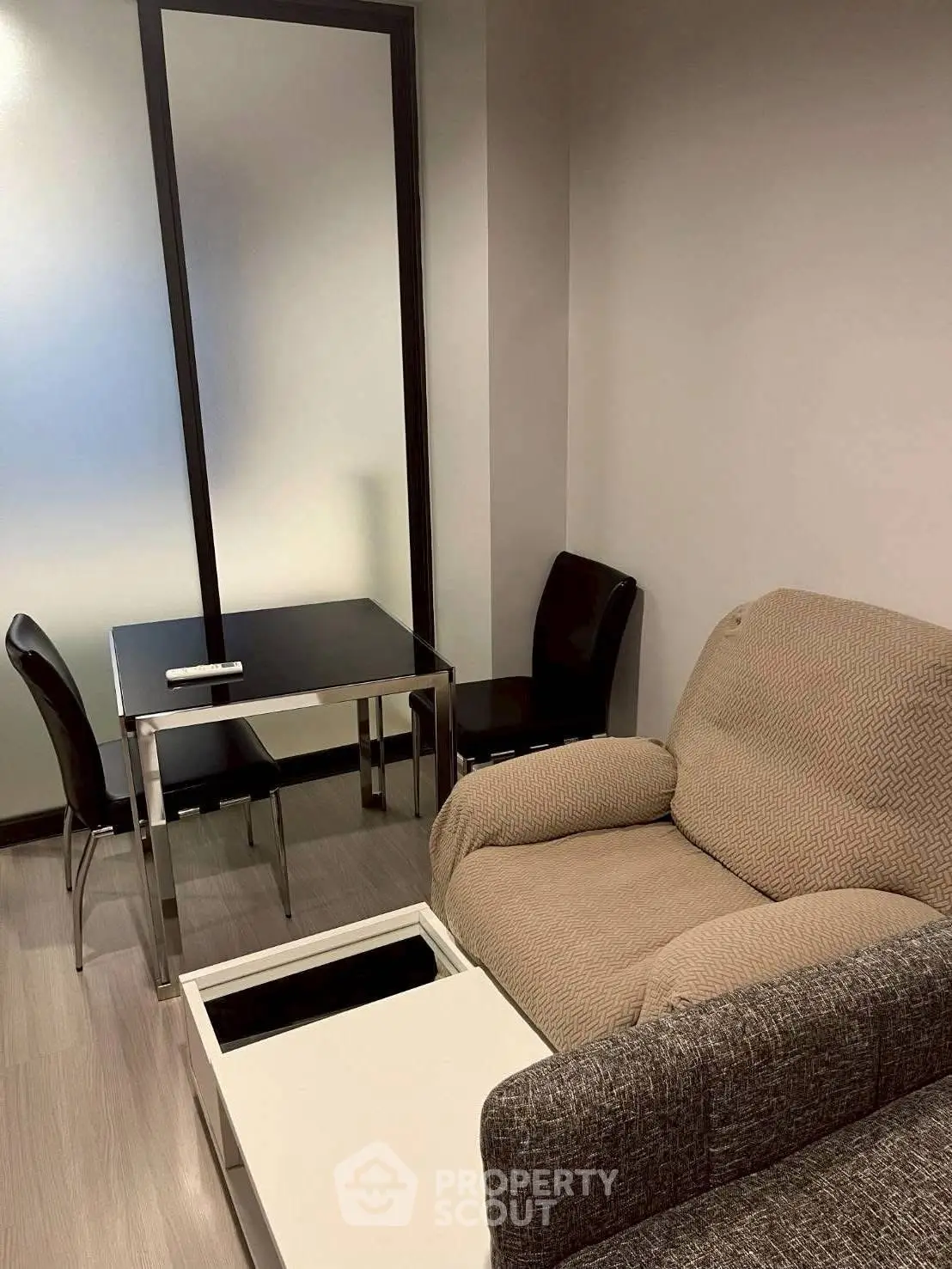 Cozy living room with modern furniture and sleek design, perfect for urban living.