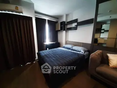 Cozy bedroom with modern decor and ample natural light