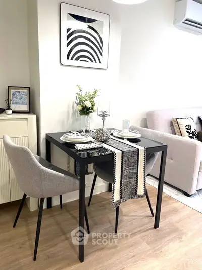 Stylish dining area with modern decor and cozy seating in a contemporary apartment.