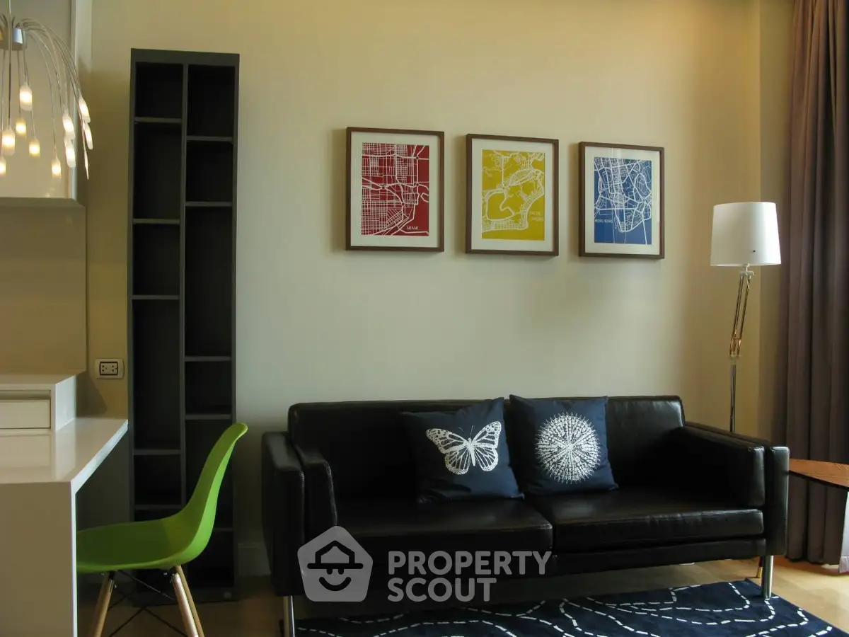 Modern living room with stylish decor and comfortable black sofa