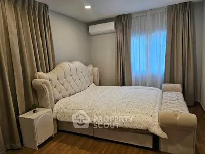 Luxurious bedroom with elegant bed and stylish decor in modern apartment.