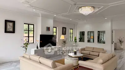 Elegant living room with modern decor, featuring plush sofas, a large TV, and a stylish chandelier.