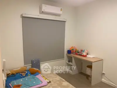 Cozy bedroom with air conditioning and minimalist decor, perfect for a peaceful retreat.