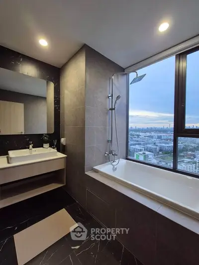 Luxurious bathroom with city view, featuring a modern bathtub and elegant fixtures.