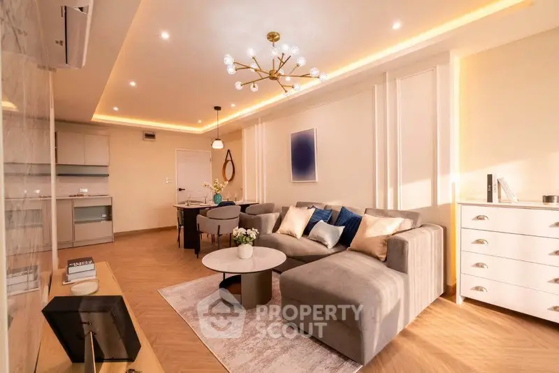 Luxurious modern living room with elegant lighting and stylish furniture in a cozy apartment.
