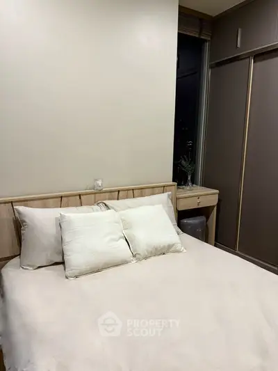 Cozy bedroom with modern decor and city view window
