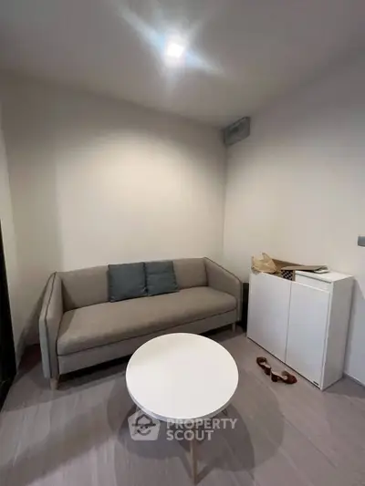 Cozy minimalist living room with modern sofa and round coffee table