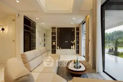 Luxurious modern living room with elegant decor and large windows offering garden views.