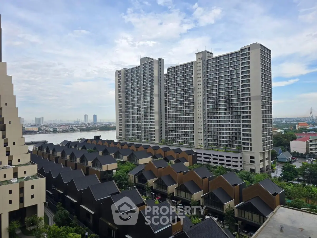 Stunning high-rise apartment complex with river view and modern townhouses