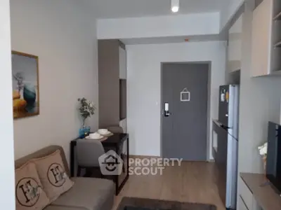 Modern apartment interior with cozy living area and compact kitchen