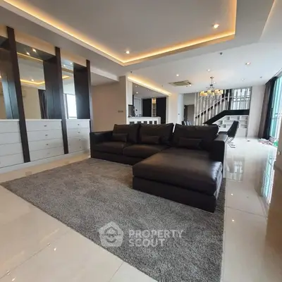 Luxurious modern living room with elegant lighting and spacious layout
