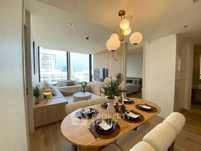 Modern open-plan living and dining area with elegant decor and city view.