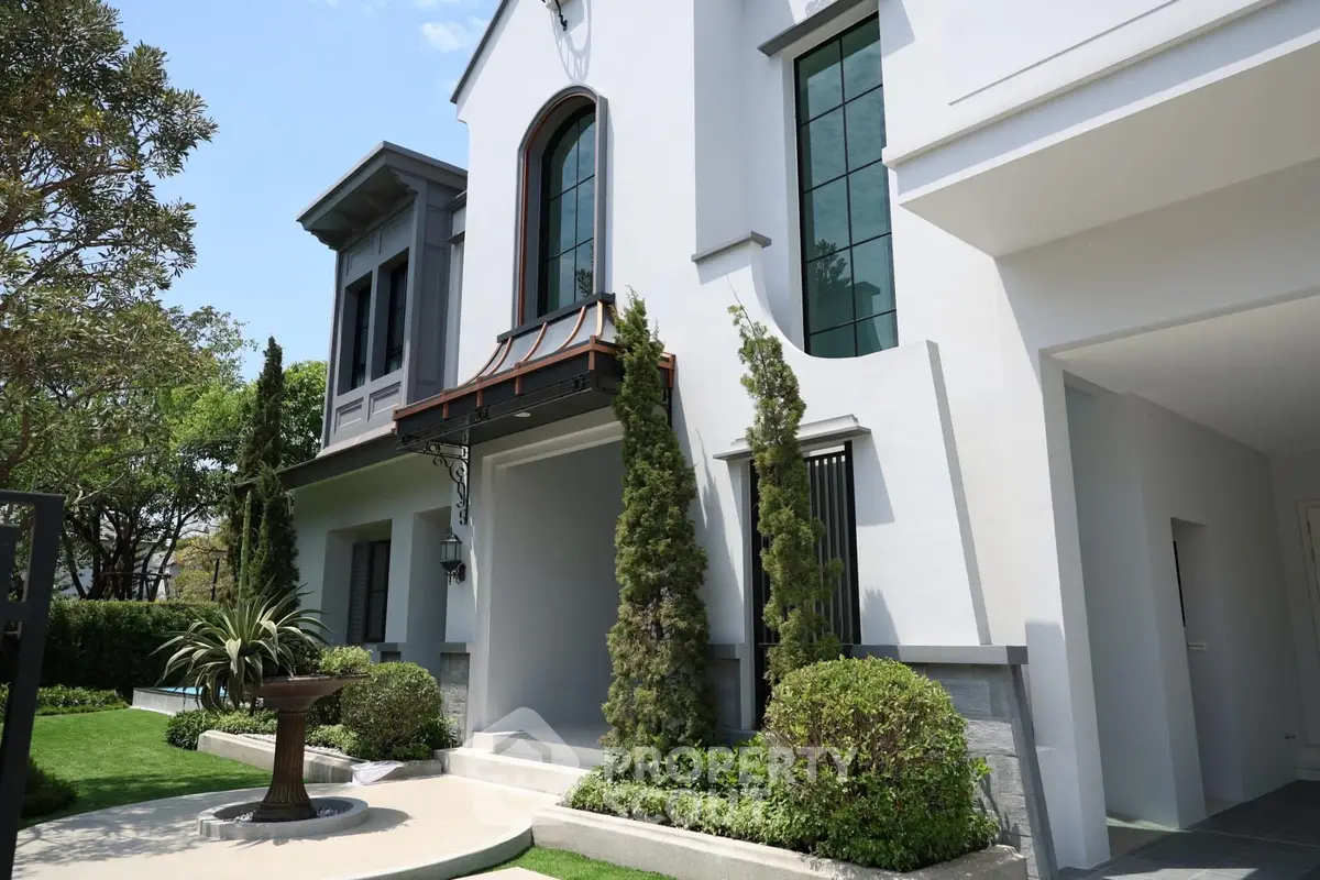 Elegant modern house exterior with lush garden and stylish architecture