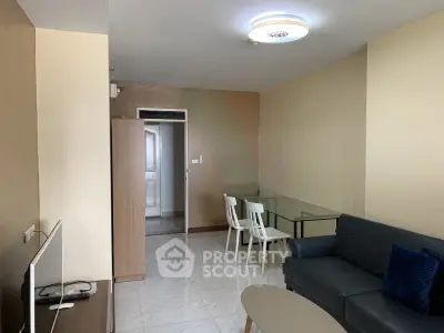 Modern living room with sleek furniture and neutral tones, perfect for relaxation and entertainment.