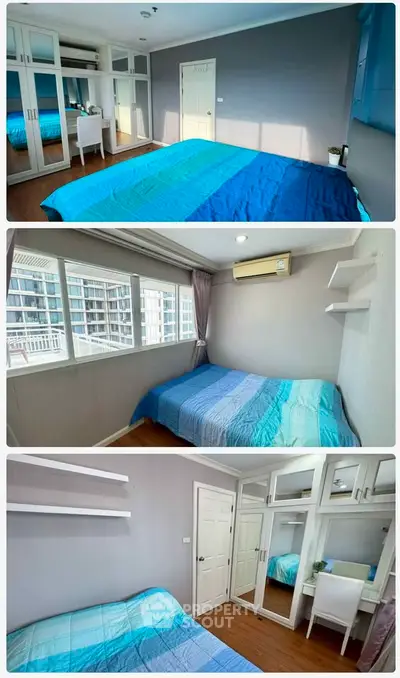 Spacious bedroom with mirrored wardrobe and large windows in modern apartment