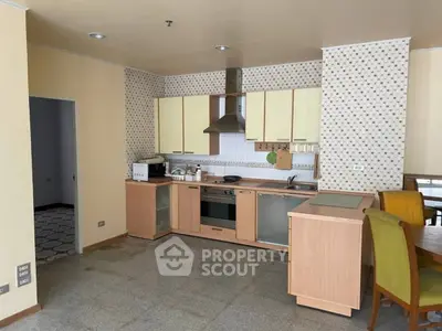 Spacious kitchen with modern appliances and open layout in a stylish apartment.