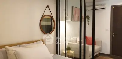 Modern bedroom with stylish decor and cozy seating area