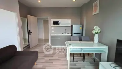 Modern open-plan living room with sleek kitchen and dining area