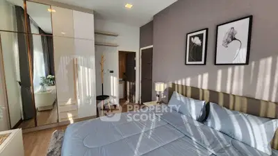 Modern bedroom with stylish decor and ample natural light