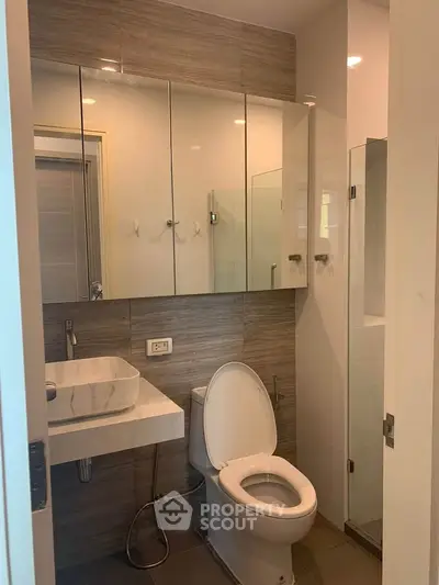 Modern bathroom with sleek fixtures and ample storage space