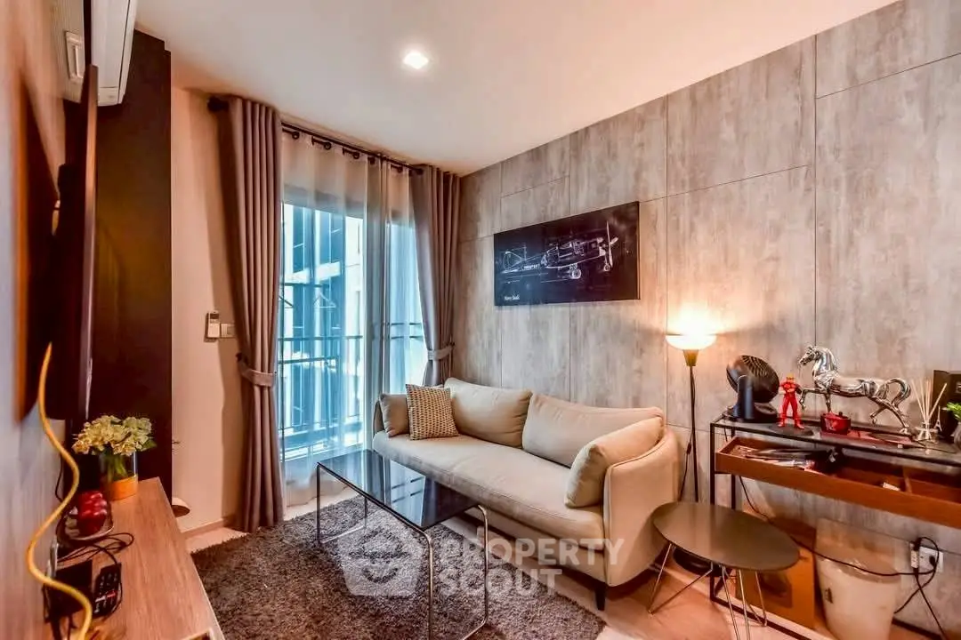 Modern living room with cozy sofa and stylish decor in a high-rise apartment.