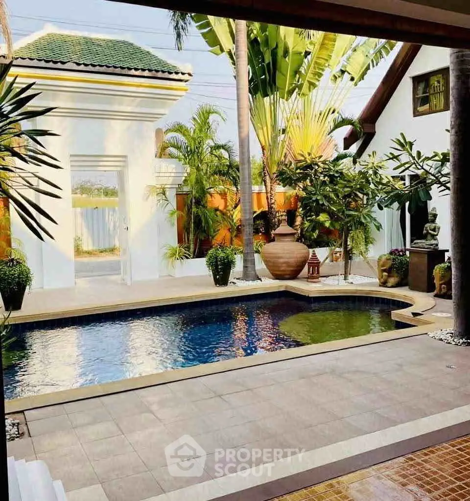 Luxurious tropical villa with private pool and lush garden, perfect for serene living.