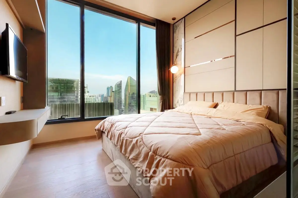 Luxurious bedroom with stunning city view and modern decor
