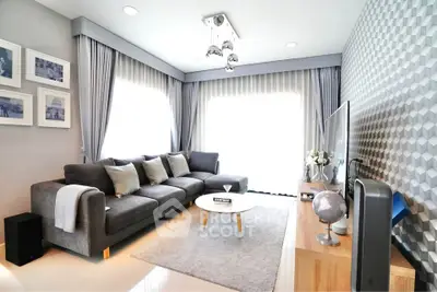 Modern living room with stylish decor and ample natural light