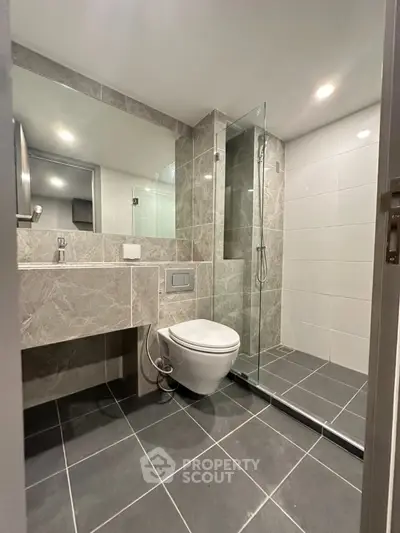 Modern bathroom with sleek design and glass shower enclosure