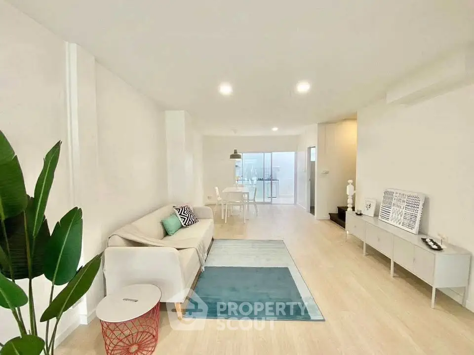 Spacious modern living room with stylish decor and natural light