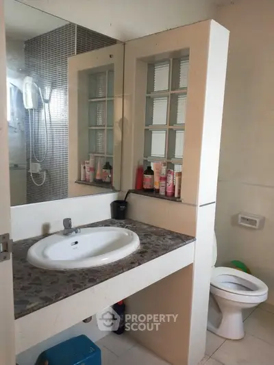 Modern bathroom with stylish vanity and shower area