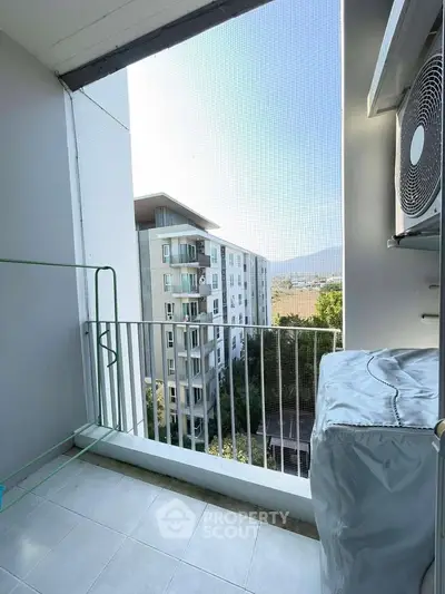 Charming balcony with mountain view in modern apartment complex