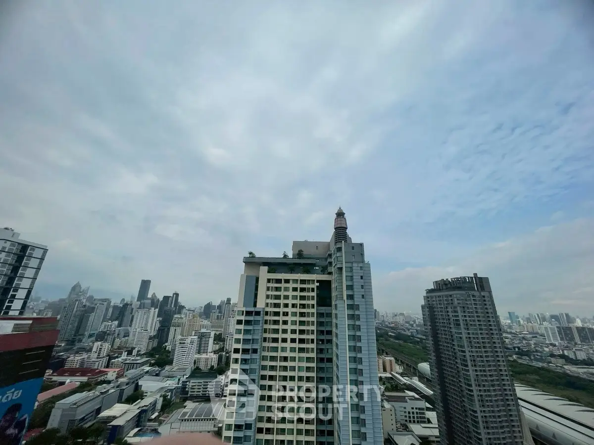 Stunning cityscape view from high-rise building showcasing urban skyline.