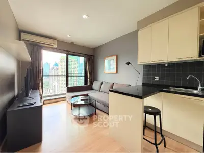 Modern living room with city view, featuring sleek furniture and open kitchen layout.