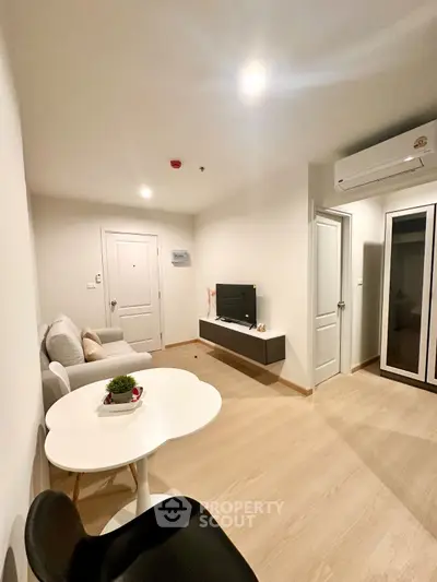 Modern living room with sleek furniture and minimalist design, perfect for urban living.