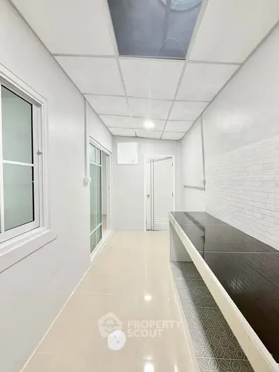 Modern interior with sleek countertops and tiled flooring, perfect for a stylish home upgrade.