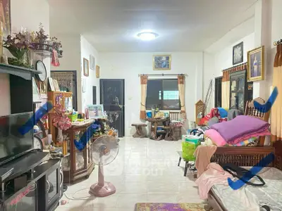 Spacious living room with eclectic decor and ample natural light