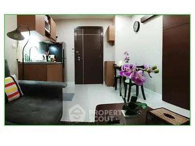 Modern living room with stylish furniture and vibrant decor in a cozy apartment.