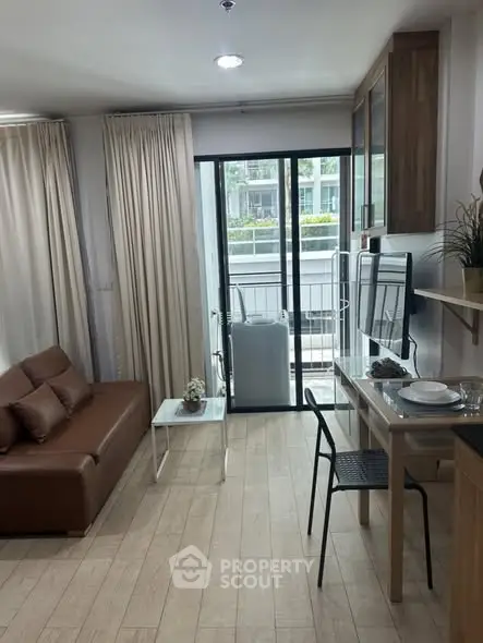 Modern living room with balcony access and stylish furniture