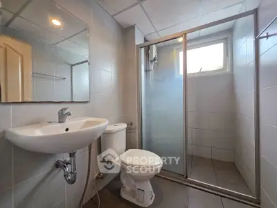 Modern bathroom with glass shower and sleek fixtures