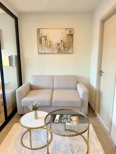Modern living room with cozy sofa and stylish coffee tables in a chic apartment.