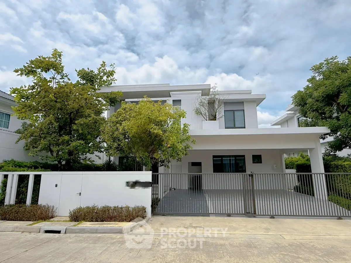 Modern two-story house with sleek design and spacious driveway