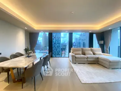 Luxurious modern living room with city view, featuring elegant dining area and cozy sectional sofa.