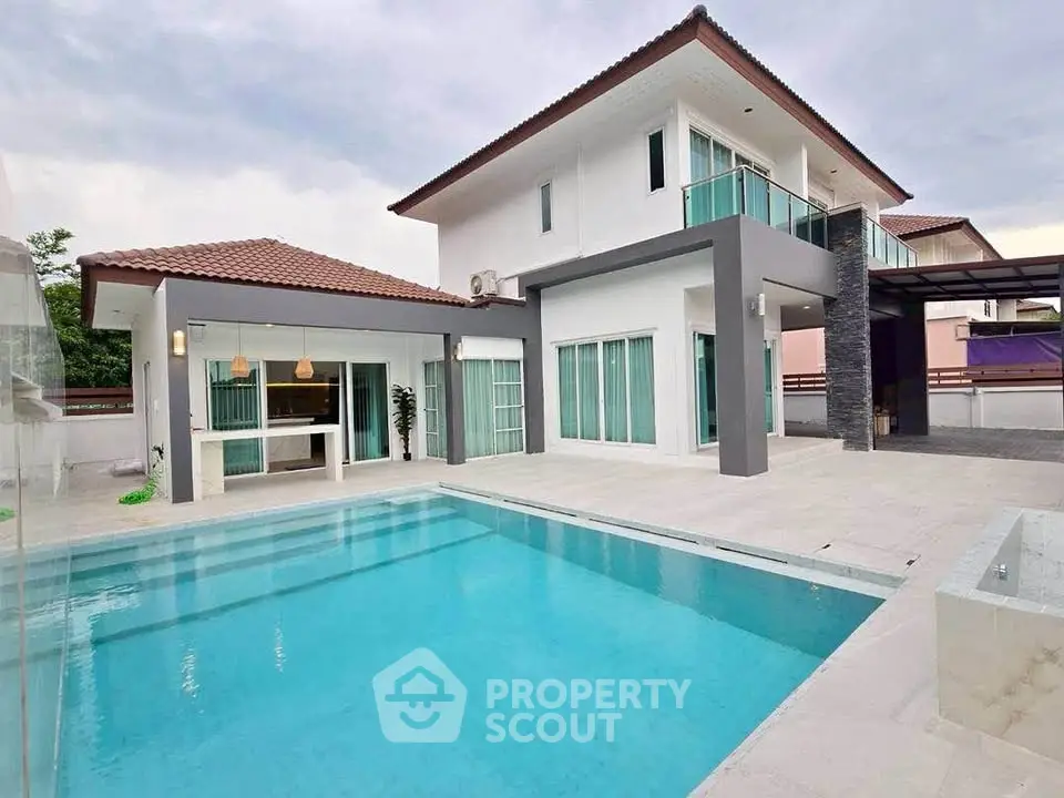 Luxurious modern villa with private pool and spacious patio, perfect for family living.