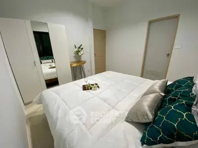 Cozy bedroom with elegant decor and plush bedding in modern apartment