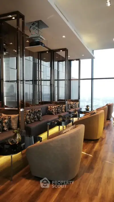 Luxurious modern living room with panoramic city views and elegant furnishings.